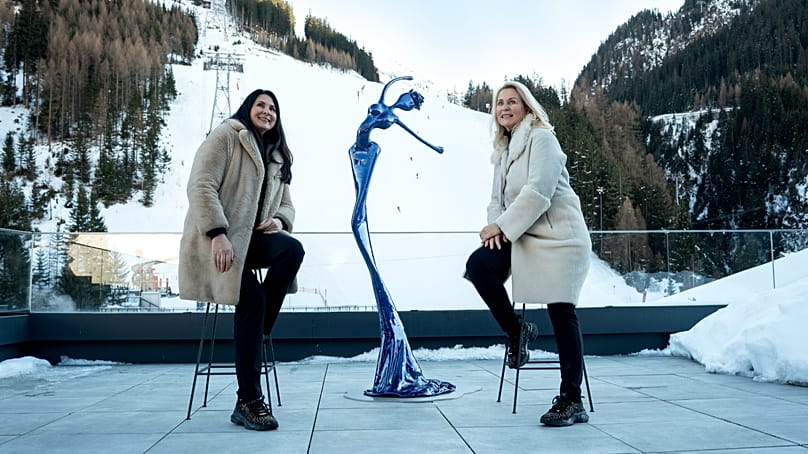 Artists Franziska and Mercedes Welte, NONOS sit beside their sculpture Sissy for the Art of Legacy exhibition 