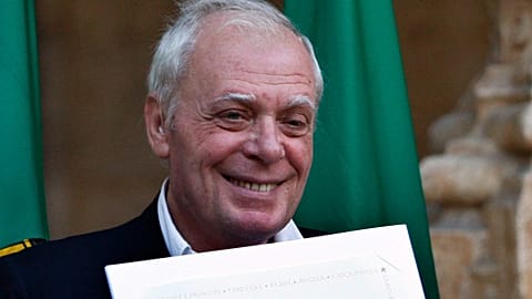 ARCHIVE ** Portuguese writer António Lobo Antunes holds his award certificate after winning the Camões Literary Prize at the Jerónimos Monastery in Lisbon, 2008.