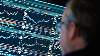 Financial information is displayed on the floor at the New York Stock Exchange in New York, Wednesday, 4 March 2026. 