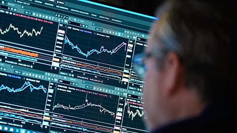 Financial information is displayed on the floor at the New York Stock Exchange in New York, Wednesday, 4 March 2026. 