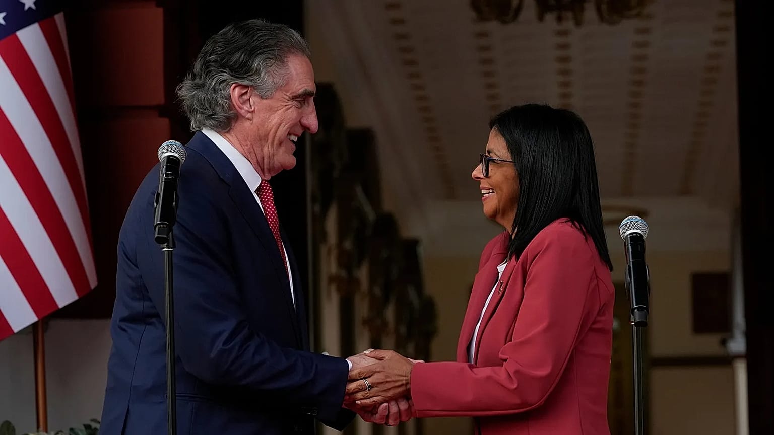Venezuela's acting President Delcy Rodriguez, right, and U.S. Interior Secretary Doug Burgum shake hands after a meeting at Miraflores presidential palace in Caracas.