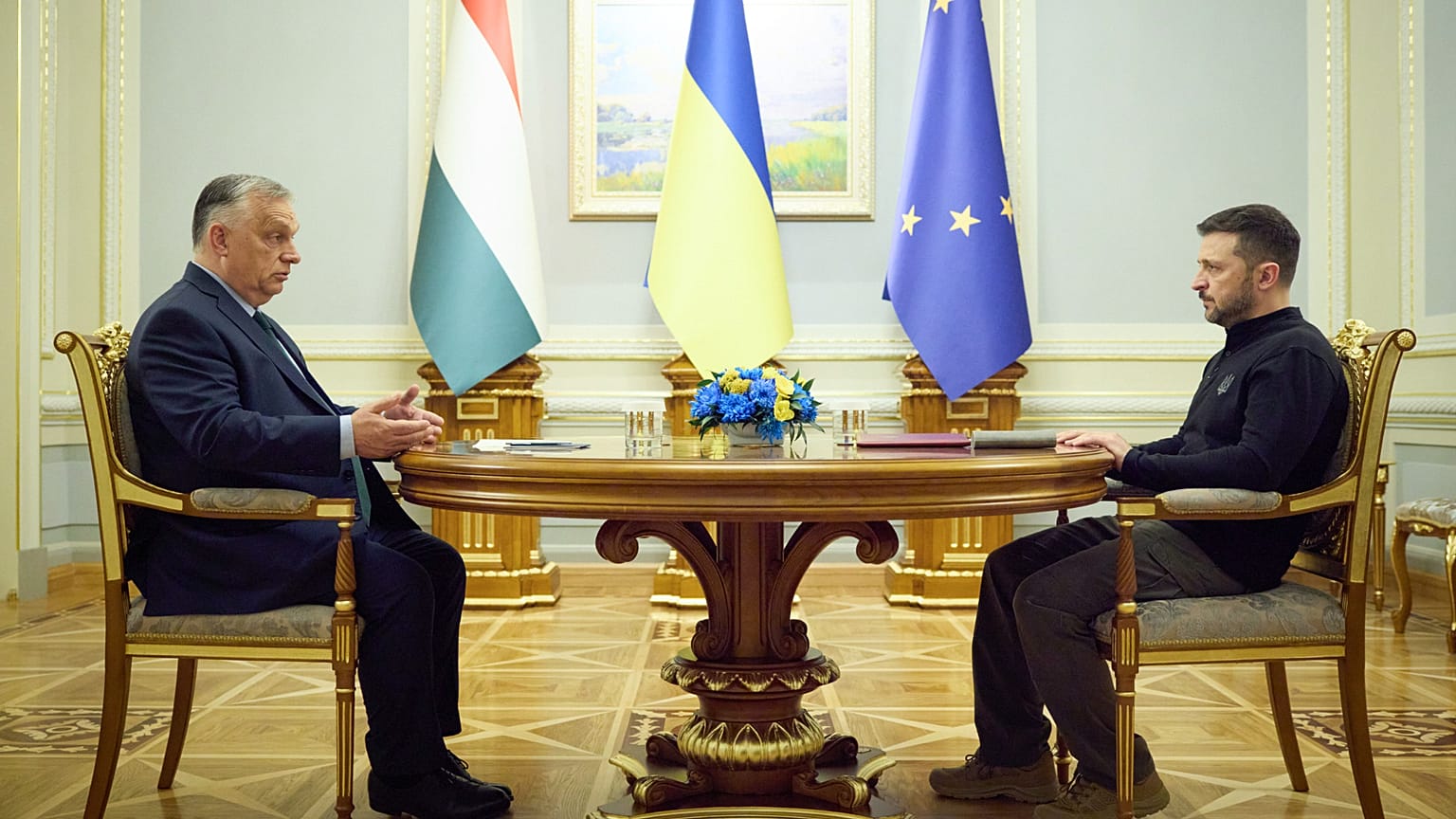 In this photo provided by the Ukrainian Presidential Press Office, Ukrainian President Volodymyr Zelenskyy, right, and Hungarian Prime Minister Viktor Orban hold a meeting in 