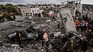 Rescue workers and military personnel operate at the scene where several people were killed in an Iranian missile strike in Beit Shemesh, Israel, Sunday, March 1, 2026. 