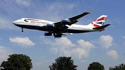 A British Airways plane coming in to land at Heathrow Airport in London