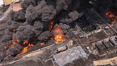FILE: An oil refinery burns outside Irbil, 13 June 2024