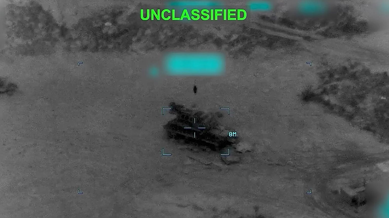 This partially redacted image from video provided by US Central Command shows a military vehicle in Iran shortly before it was struck by US, 2 March, 2026