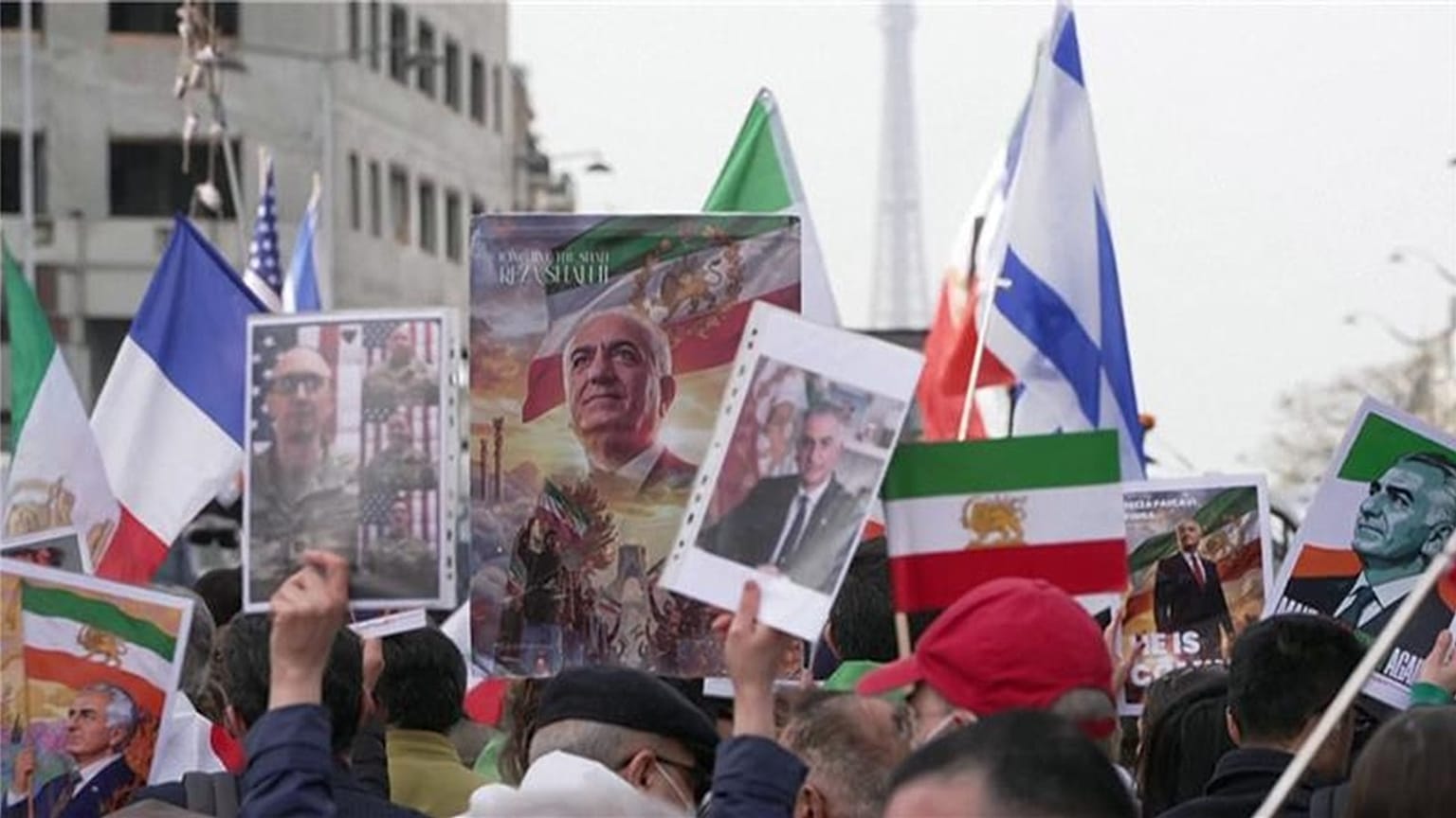Protesters in Paris brandish portraits of the son of Iran’s last Shah, Reza Pahlavi, flags of the Iranian monarchy, and French and Israeli flags, 7 March, 2026.