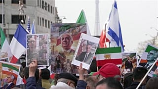 Protesters in Paris brandish portraits of the son of Iran’s last Shah, Reza Pahlavi, flags of the Iranian monarchy, and French and Israeli flags, 7 March, 2026.