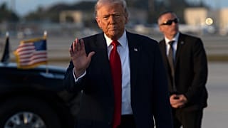 President Donald Trump gestures after stepping off Air Force One, Saturday, March 7, 2026, at Miami International Airport in Miami. (AP Photo/Mark Schiefelbein)