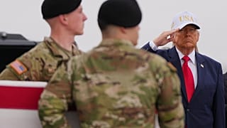 President Donald Trump salutes as an Army carry team moves the flag-draped transfer case containing the remains of U.S. Army Reserve Sgt. Declan Coady, 20, of West Des Moines,