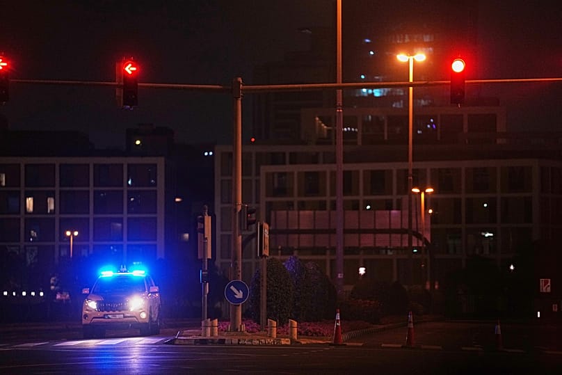 A police car blocks a street leading to the US consulate after an Iranian drone struck a parking lot outside the compound, 4 March, 2026