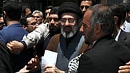 FILE - Mojtaba Khamenei, the son of Iranian Supreme Leader Ayatollah Ali Khamenei, center, attends the annual Quds, or Jerusalem Day rally in Tehran, Iran, on May 31, 2019