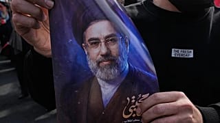 A man holds a poster of Ayatollah Mojtaba Khamenei in Tehran, 9 March, 2026