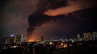 Flames and smoke rise from an oil storage facility struck as attacks hit the city during the U.S.–Israeli military campaign in Tehran, Iran, late Saturday, March 7, 2026