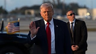 US President Donald Trump gestures after stepping off Air Force One in Miami, 7 March, 2026