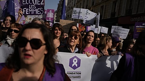 Gisele Pelicot, center, attends a march to mark International Women's Day in Paris, Sunday, March 8, 2026.