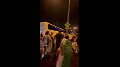 People running after a bus carrying the Iranian women's football team in Australia's Gold Coast. 