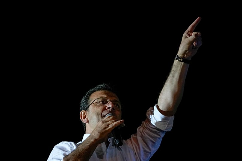 FILE - Istanbul Mayor and Republican People's Party, or CHP, candidate Ekrem Imamoglu addresses supporters outside the City Hall in Istanbul, Turkey, early April 1, 2024. 