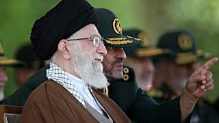 FILE: Ayatollah Ali Khamenei listens to the then commander of the Revolutionary Guard Mohammad Ali Jafari during a graduation ceremony in Tehran, 20 May 2015