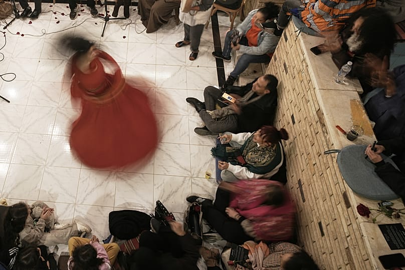 Female whirling dervish, Afnan Shaher, spins during a religious performance to mark the holy month of Ramadan, Arab Digital Expression Foundation, Cairo, Egypt, Feb. 27, 2026