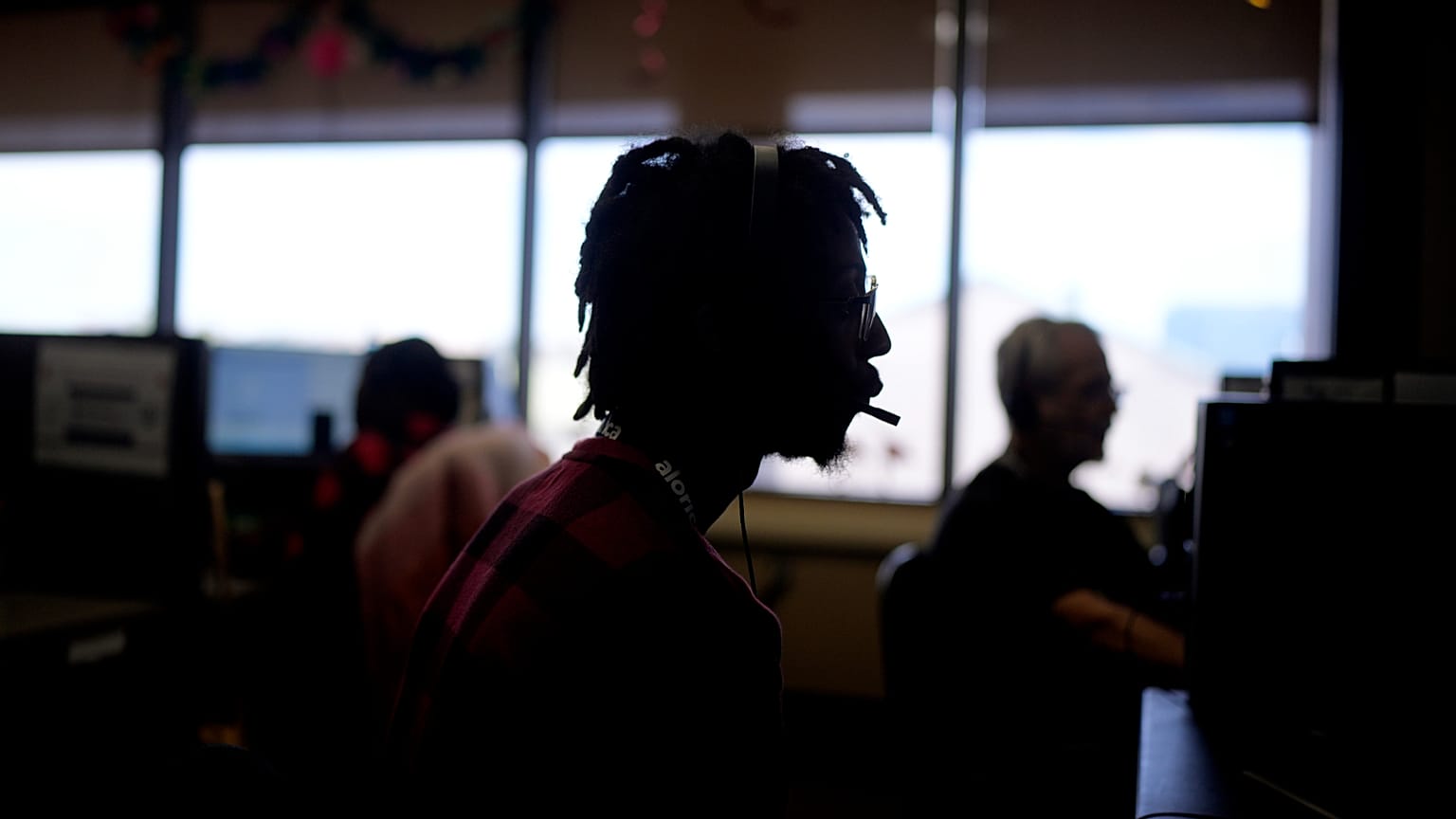 AI Job Market  Customer Experience Representative Rico Thomas takes calls at an Alorica center, Monday, Aug. 19, 2024, in San Antonio.