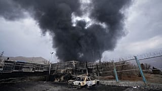 FILE - A thick plume of smoke rises from an oil storage facility hit by a US-Israeli strike in Tehran, 8 March 2026