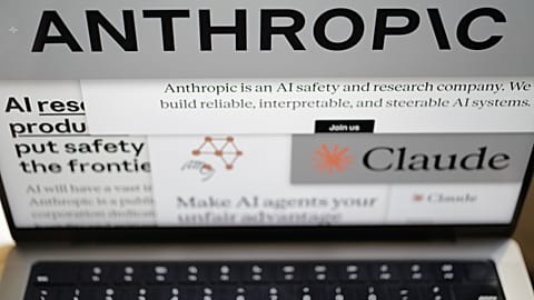Pages from the Anthropic website and the company's logos are displayed on a computer screen in New York on Thursday, Feb. 26, 2026.
