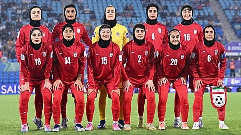 Iranian players pose for a team photo ahead of the Women's Asian Cup soccer match between Iran and the Philippines in Robina, 8 March, 2026