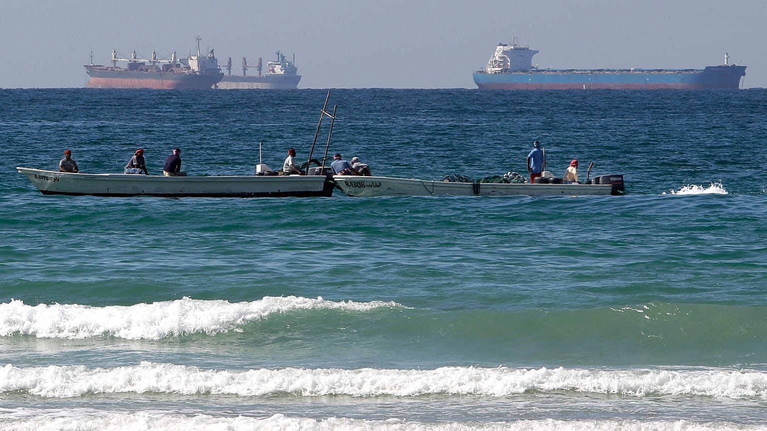 In this Jan. 19, 2012 file photo, fishing boats are seen in front of oil tankers south of the Strait of Hormuz, offshore the town of Ras Al Khaimah in United Arab Emirates