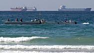 In this Jan. 19, 2012 file photo, fishing boats are seen in front of oil tankers south of the Strait of Hormuz, offshore the town of Ras Al Khaimah in United Arab Emirates