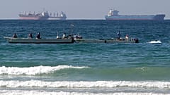 In this Jan. 19, 2012 file photo, fishing boats are seen in front of oil tankers south of the Strait of Hormuz, offshore the town of Ras Al Khaimah in United Arab Emirates
