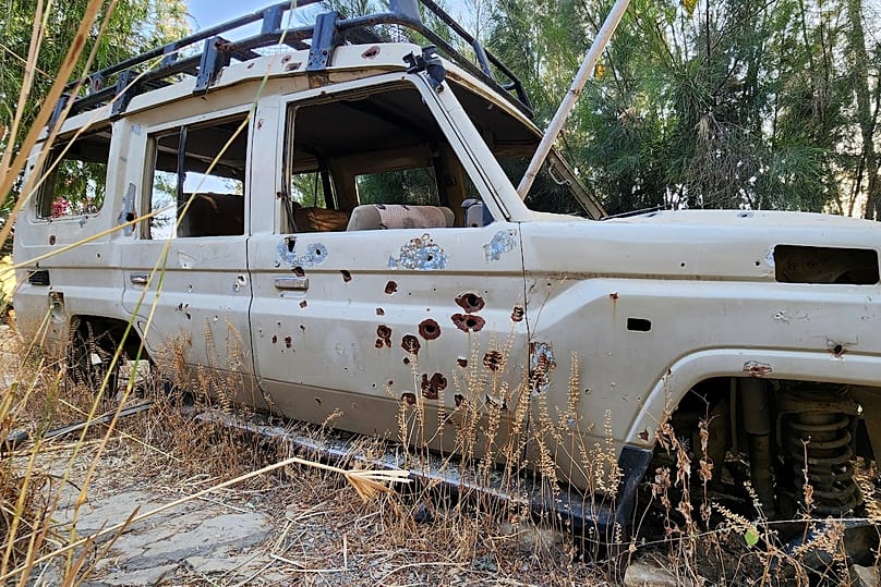 A bullet-riddled vehicle sits abandoned on the grounds of Wukro Lodge, once occupied by Eritrean troops, in the Tigray region of northern Ethiopia, on Jan. 26, 2026. 