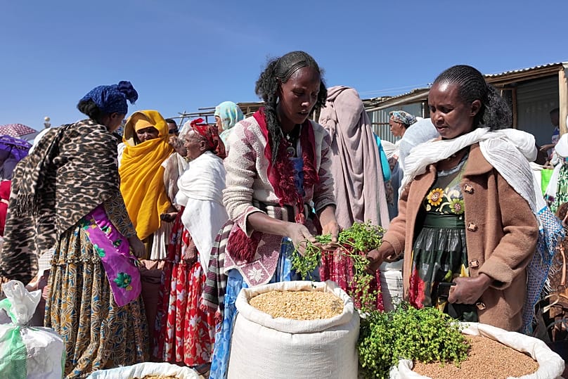 Ethiopian women buy and sell goods at a street market in Mekelle in the Tigray region of northern Ethiopia, Monday, Jan. 26, 2026.