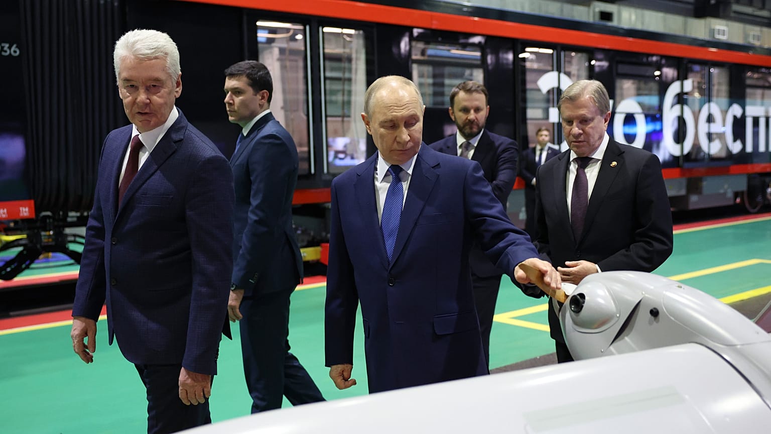 Vladimir Putin, accompanied by his Minister of Industry and Trade Anton Alikhanov, at an exhibition of autonomous vehicles, Moscow, Russia, Jan. 2026
