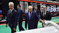 Vladimir Putin, accompanied by his Minister of Industry and Trade Anton Alikhanov, at an exhibition of autonomous vehicles, Moscow, Russia, Jan. 2026