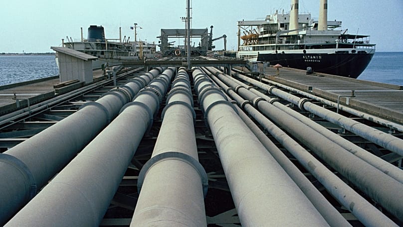 This is a view of the pipes and a tanker on Kharg jetty in Iran, July, 1971