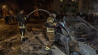 Rescuers put out the fire at a residential neighbourhood following Russia's drone attack in Kharkiv, Ukraine, late Monday, 9 March, 2026.