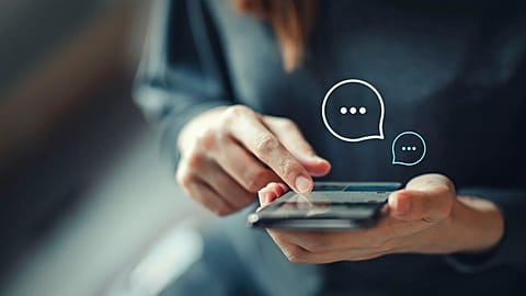 A woman with her mobile phone.