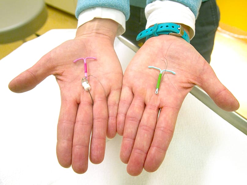Dr. Susan Gorman displays the Skyla IUD, left, and the Mirena IUD, at High Lakes Gynecology in Redmond, Ore., Jan. 14, 2015.