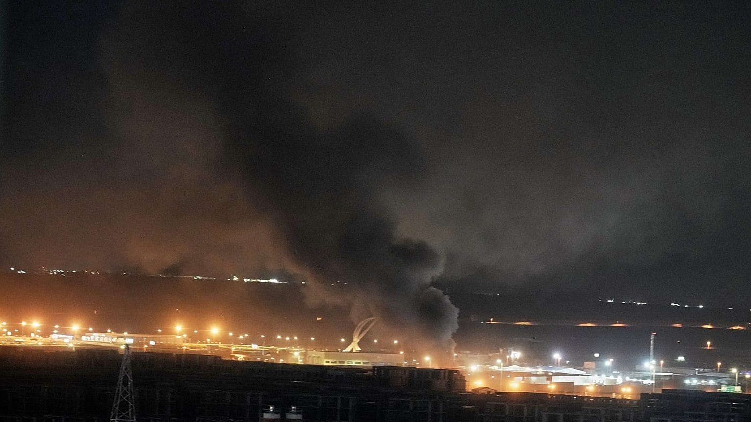 Smoke rises after an explosion at the airport in Irbil, Iraq, late Wednesday, March 11, 2026
