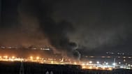 Smoke rises after an explosion at the airport in Irbil, Iraq, late Wednesday, March 11, 2026