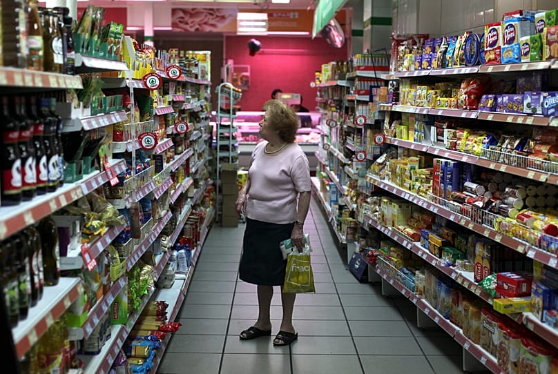 Woman in a supermarket in Lisbon, Portugal. 