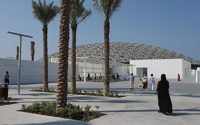 FILE: People visit the Louvre Museum, during the public opening day, in Abu Dhabi, United Arab Emirates, Saturday, Nov. 11, 2017