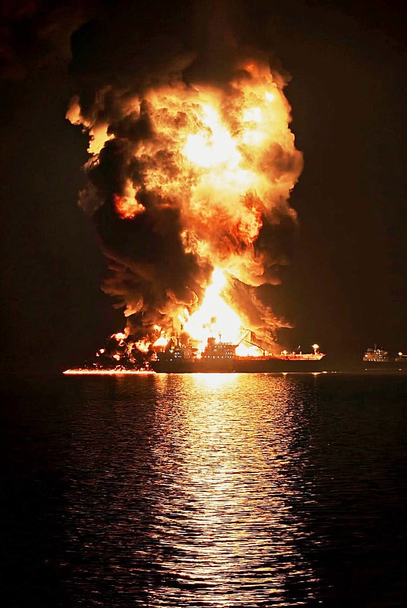 An oil tanker burns after being hit by an Iranian strike in the ship-to-ship transfer zone at Khor al-Zubair port near Basra, Iraq, late Wednesday, March 11, 2026.