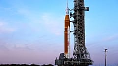 NASA's Artemis II SLS (Space Launch System) moon rocket with the Orion spacecraft slowly rolls back towards the Vehicle Assembly Building at the Kennedy Space Center.