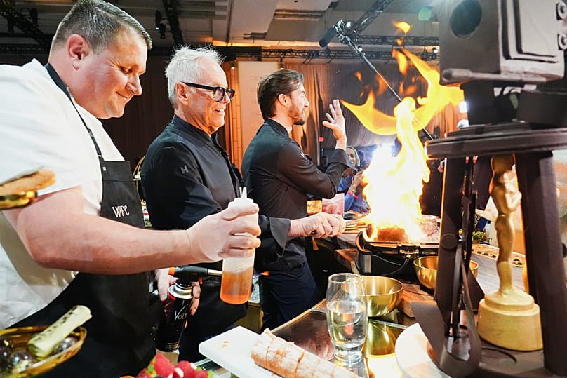 Eric Klein, from left, Wolfgang Puck, and Byron Puck seen during the Oscars Governors Ball press preview, Tuesday, March 10, 2026, in Los Angeles. 