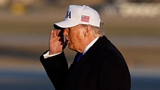 US President Donald Trump salutes as he prepares to board Air Force One in Maryland, 13 March, 2026