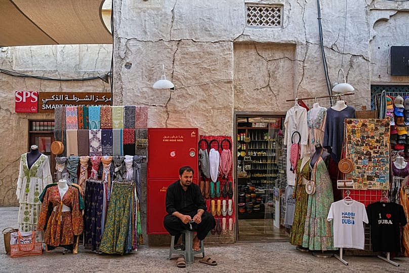 A vendor waits for customers at the Al Seef market in Dubai, 13 March, 2026