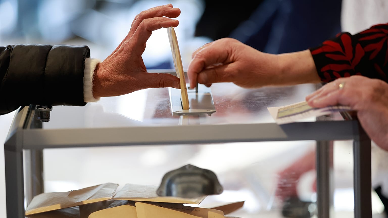 A woman castes her ballot during the first round of France's municipal elections in Henin-Beaumont, northern France, Sunday, March 15, 2026.