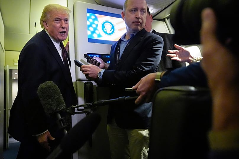 President Donald Trump speaks to reporters aboard Air Force One, Sunday, March 15, 2026, en route from West Palm Beach, Fla. to Joint Base Andrews, Maryland
